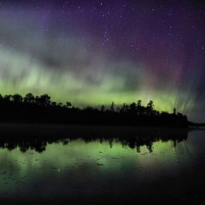 Northern Lights near Bearskin Lodge over a lake